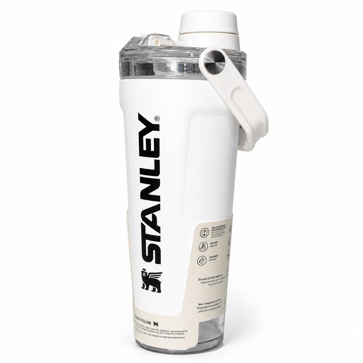 A white Stanley water bottle with a clear lid, white flip-top cap, and a white carrying loop, featuring the black Stanley logo on the side.