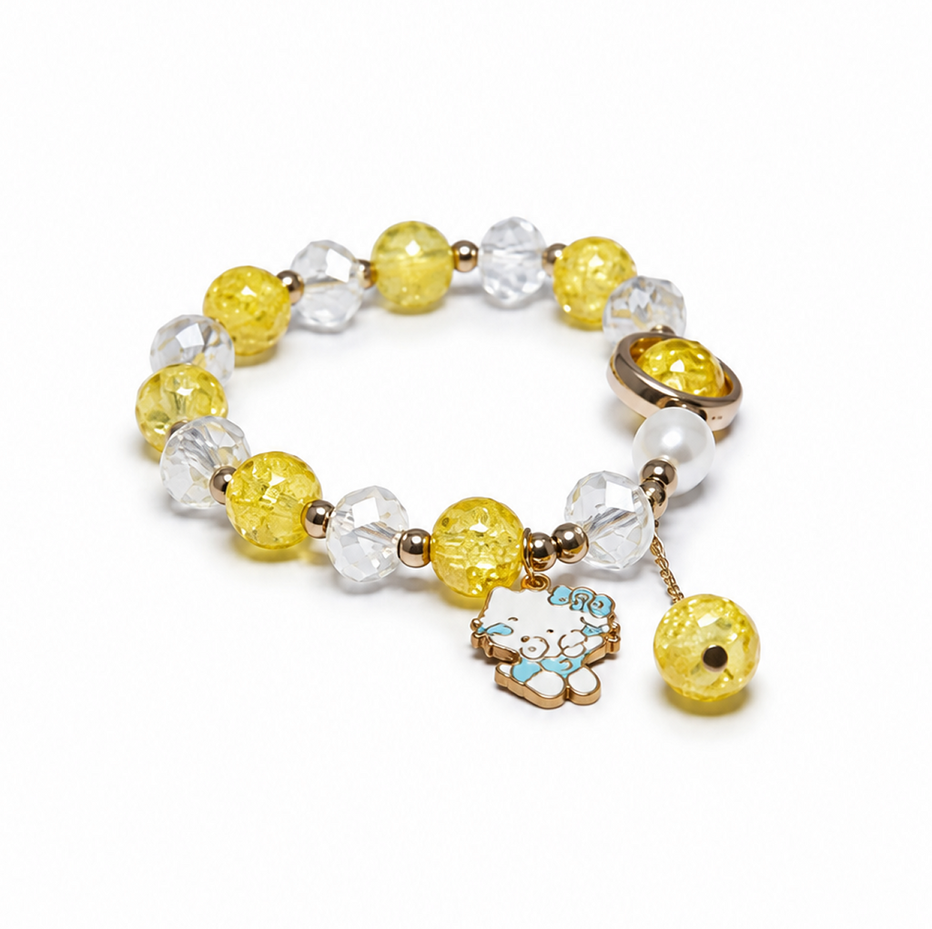 A beaded bracelet featuring yellow faceted beads, clear crystal beads, a white pearl, and a dangling Hello Kitty charm with a yellow bead accent, set against a plain white background.