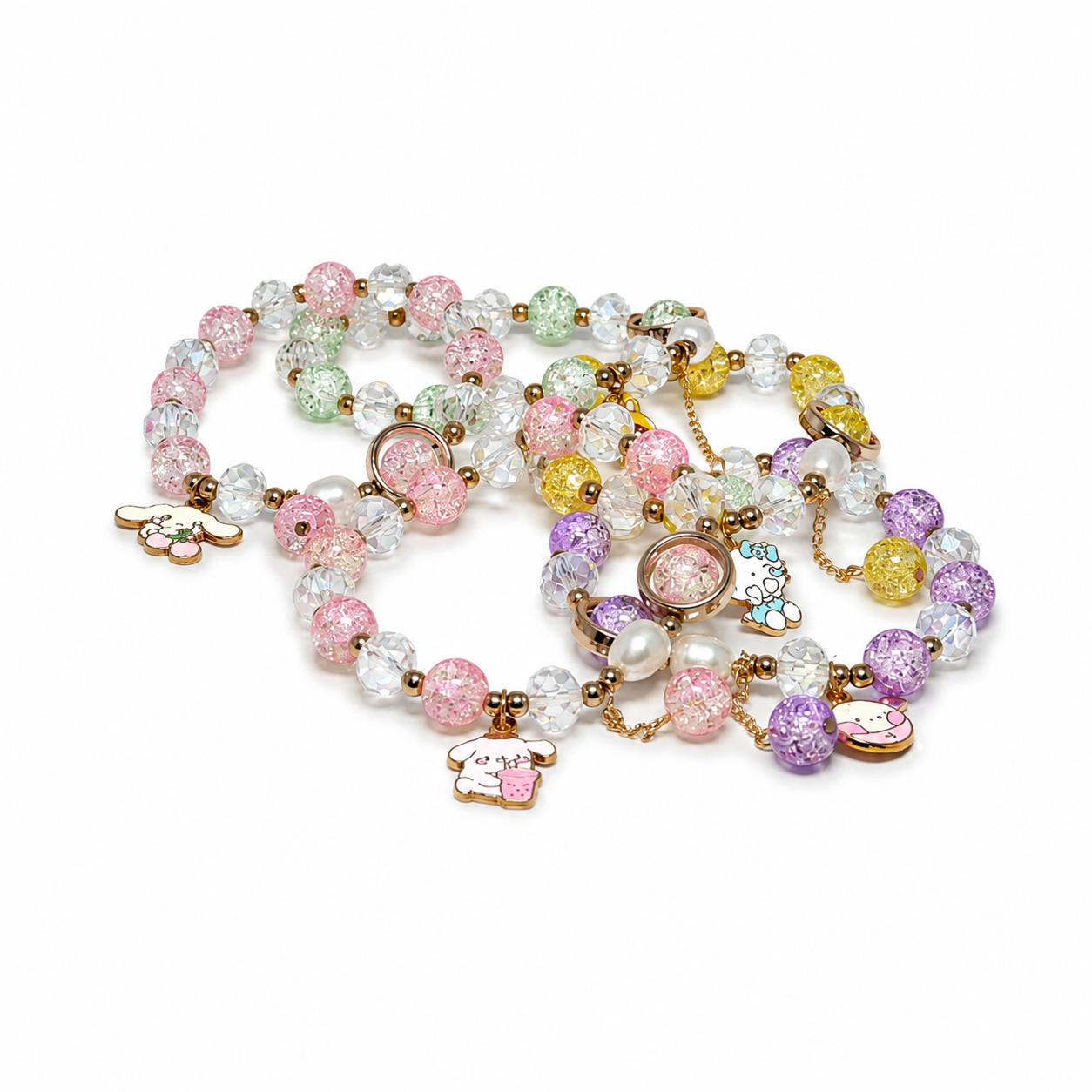 A pastel beaded necklace with clear faceted beads, pink and lavender beads, pearl-like accents, and small cartoon charms on a gold-tone chain, photographed on a white background.