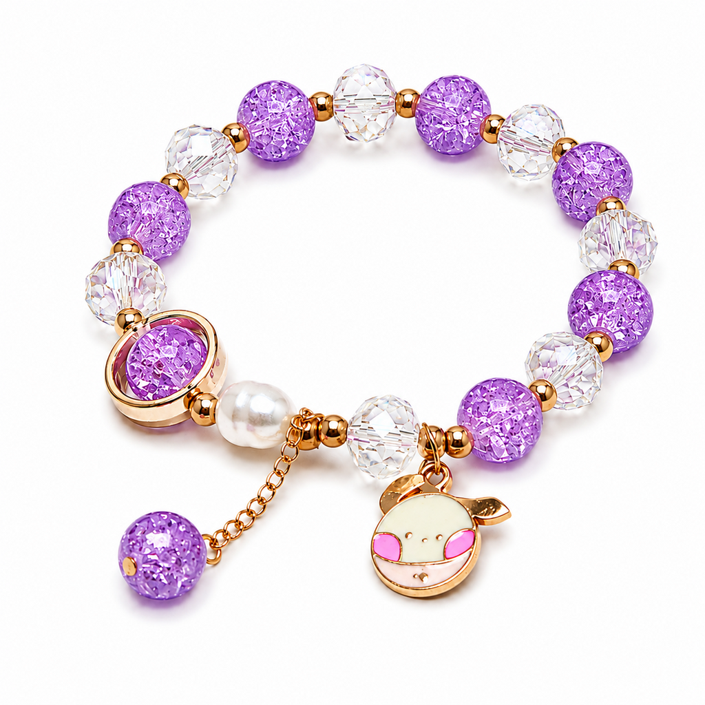 A beaded stretch bracelet featuring purple glitter beads, clear faceted beads, a white pearl, and a gold-tone charm with a cartoon character face, shown on a white background.